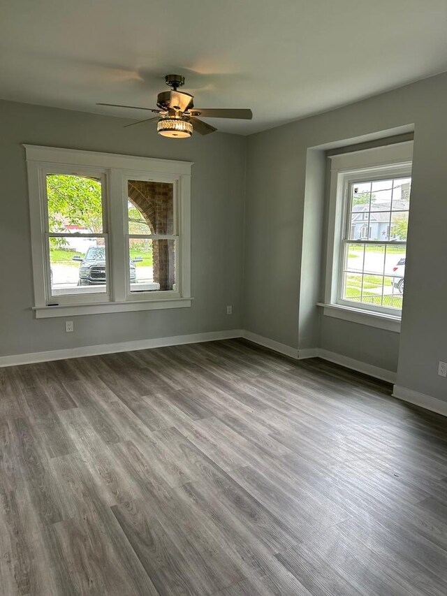 904 Johnson St, Streator, IL 61364 - empty room with a ceiling fan, wood finished floors, and baseboards