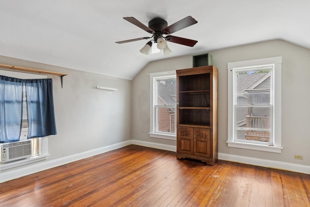 458 Douglas St, Joliet, IL 60435 - spare room featuring lofted ceiling, hardwood / wood-style floors, a ceiling fan, and cooling unit