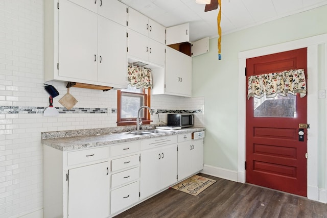 458 Douglas St, Joliet, IL 60435 - kitchen featuring light countertops, dark wood-style flooring, and white cabinetry