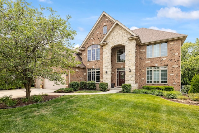 13738 Legend Trail Ln, Orland Park, IL 60462 - view of front facade featuring concrete driveway, a front lawn, brick siding, a shingled roof, and stone siding