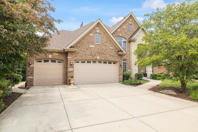 13738 Legend Trail Ln, Orland Park, IL 60462 - traditional-style home featuring driveway, brick siding, a garage, and roof with shingles