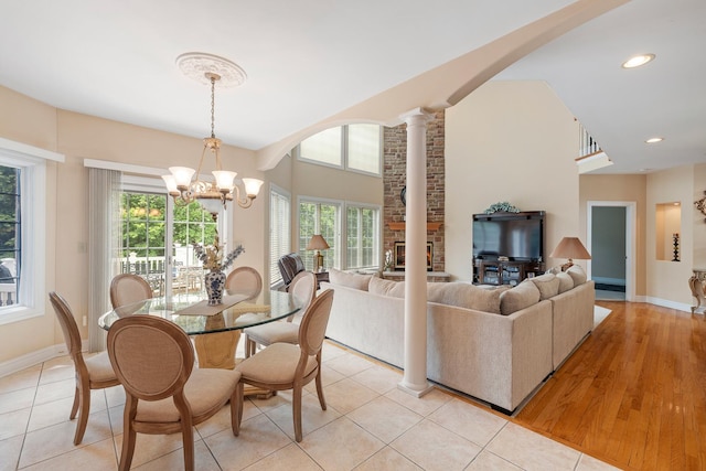 13738 Legend Trail Ln, Orland Park, IL 60462 - dining area featuring a chandelier, arched walkways, baseboards, recessed lighting, and ornate columns