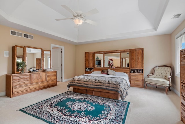 13738 Legend Trail Ln, Orland Park, IL 60462 - bedroom featuring a raised ceiling, light colored carpet, ceiling fan, and baseboards