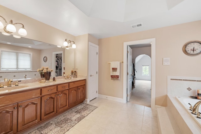 13738 Legend Trail Ln, Orland Park, IL 60462 - bathroom featuring double vanity, a garden tub, plenty of natural light, and baseboards