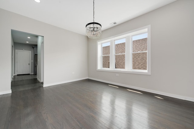 7925 S May St, Chicago, IL 60620 - empty room featuring a chandelier, dark wood-type flooring, baseboards, and recessed lighting