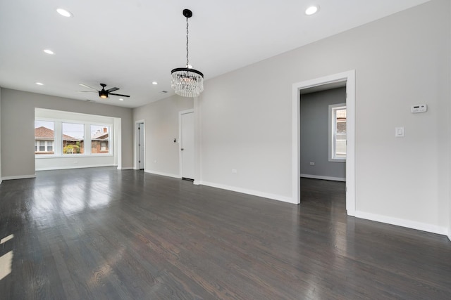 7925 S May St, Chicago, IL 60620 - unfurnished living room featuring ceiling fan, recessed lighting, dark wood-style flooring, baseboards, and a chandelier
