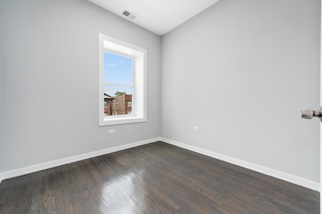 7925 S May St, Chicago, IL 60620 - unfurnished room with baseboards and dark wood-style flooring