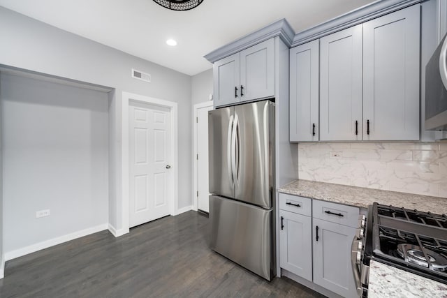 7925 S May St, Chicago, IL 60620 - kitchen with appliances with stainless steel finishes, baseboards, backsplash, recessed lighting, and dark wood-style flooring