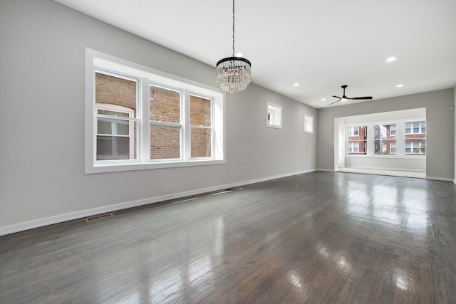 7925 S May St, Chicago, IL 60620 - empty room featuring recessed lighting, ceiling fan, dark wood-style floors, baseboards, and a chandelier