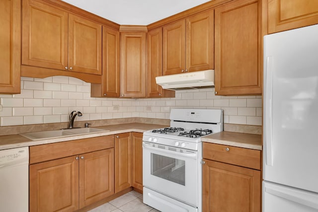 402 Kenyon Ave, Romeoville, IL 60446 - kitchen featuring white appliances, under cabinet range hood, decorative backsplash, and light countertops