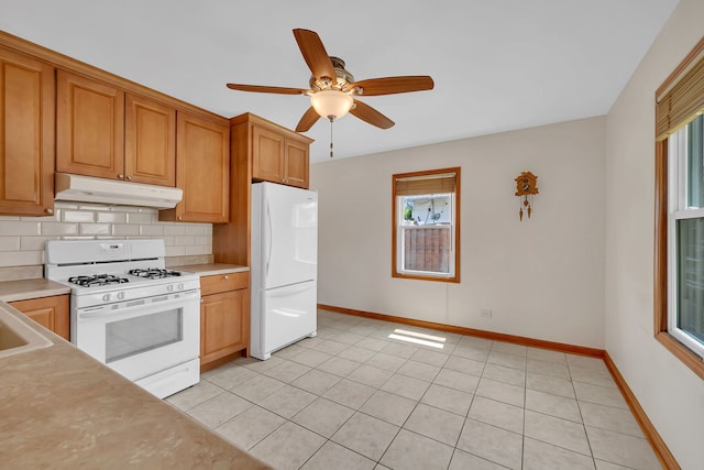 402 Kenyon Ave, Romeoville, IL 60446 - kitchen with white appliances, under cabinet range hood, backsplash, light countertops, and ceiling fan
