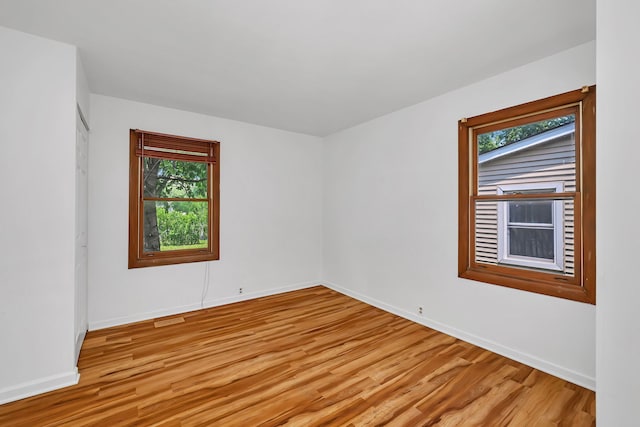 402 Kenyon Ave, Romeoville, IL 60446 - spare room with light wood-style flooring and plenty of natural light