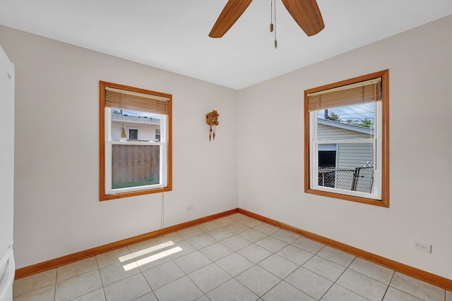 402 Kenyon Ave, Romeoville, IL 60446 - empty room with healthy amount of natural light, baseboards, and a ceiling fan