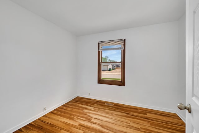 402 Kenyon Ave, Romeoville, IL 60446 - unfurnished room with light wood-style floors and baseboards