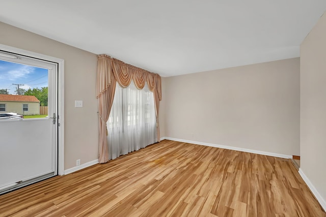 402 Kenyon Ave, Romeoville, IL 60446 - spare room with light wood-type flooring and baseboards