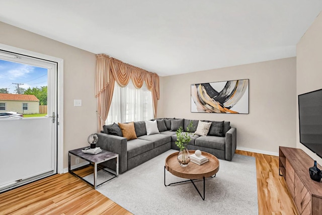 402 Kenyon Ave, Romeoville, IL 60446 - living area with light wood-type flooring and healthy amount of natural light
