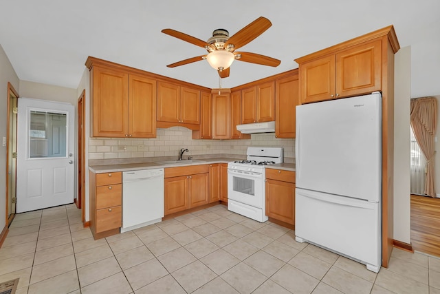 402 Kenyon Ave, Romeoville, IL 60446 - kitchen featuring white appliances, under cabinet range hood, a sink, and light countertops