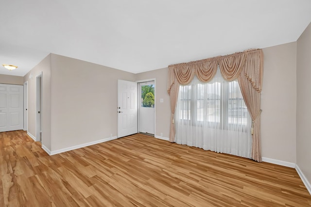 402 Kenyon Ave, Romeoville, IL 60446 - foyer entrance with light wood-style flooring and baseboards