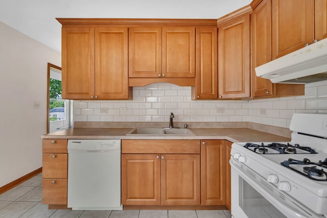 402 Kenyon Ave, Romeoville, IL 60446 - kitchen with white appliances, a sink, under cabinet range hood, and tasteful backsplash