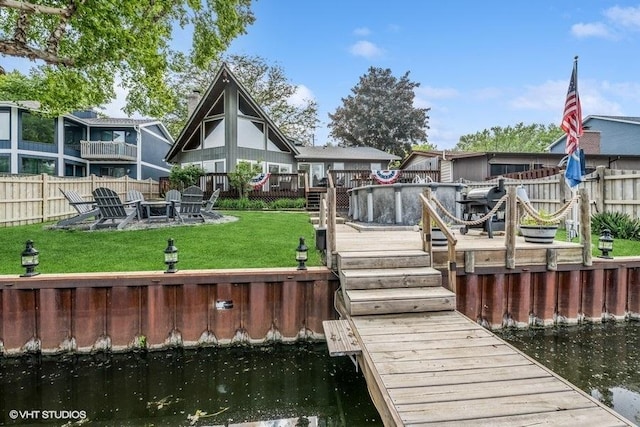610 Mchenry Ave, Mchenry, IL 60050 - dock featuring a deck with water view and a fire pit