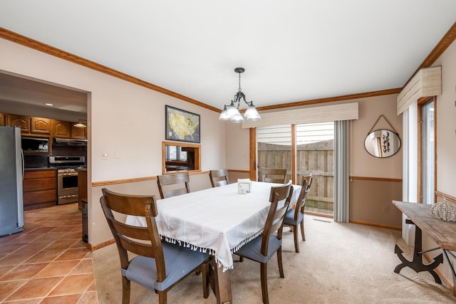 610 Mchenry Ave, Mchenry, IL 60050 - dining area with ornamental molding, baseboards, and a chandelier