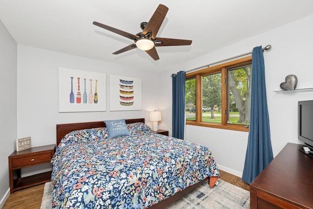 610 Mchenry Ave, Mchenry, IL 60050 - bedroom with wood finished floors, baseboards, and ceiling fan