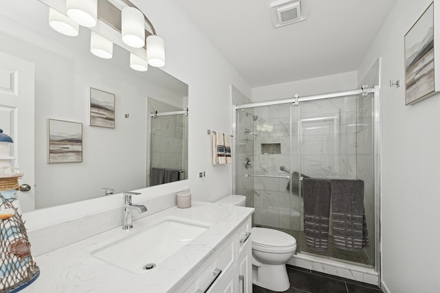 610 Mchenry Ave, Mchenry, IL 60050 - full bath featuring vanity, toilet, a stall shower, and tile patterned floors