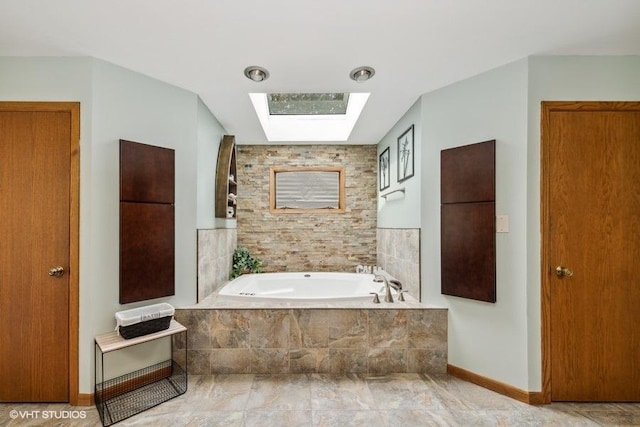 610 Mchenry Ave, Mchenry, IL 60050 - bathroom with a skylight, a garden tub, and baseboards