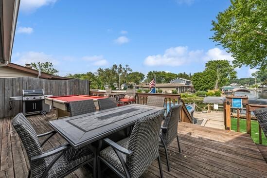610 Mchenry Ave, Mchenry, IL 60050 - wooden terrace featuring area for grilling and outdoor dining area