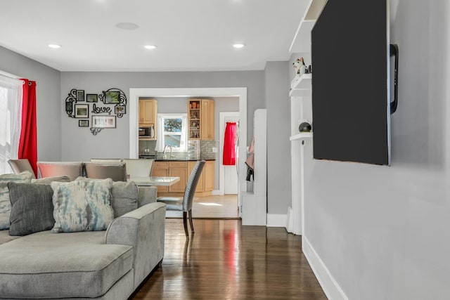 1313 W Cornelia Ave, Waukegan, IL 60085 - living room featuring dark wood-style floors, baseboards, and recessed lighting