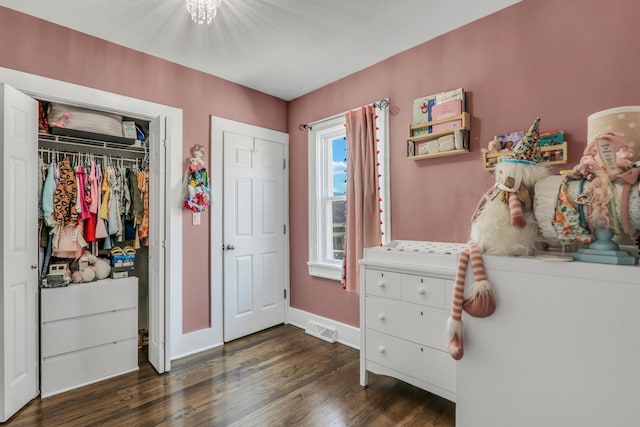 1313 W Cornelia Ave, Waukegan, IL 60085 - bedroom with dark wood-type flooring, baseboards, and a closet