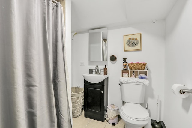 1313 W Cornelia Ave, Waukegan, IL 60085 - bathroom featuring tile patterned floors, vanity, toilet, and curtained shower