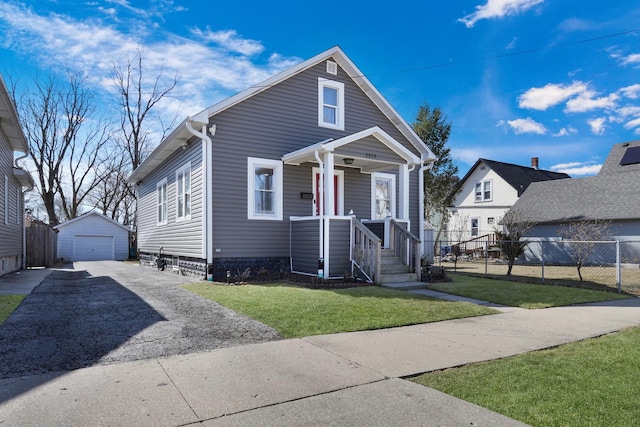 1313 W Cornelia Ave, Waukegan, IL 60085 - view of front of home with asphalt driveway, a garage, and an outdoor structure