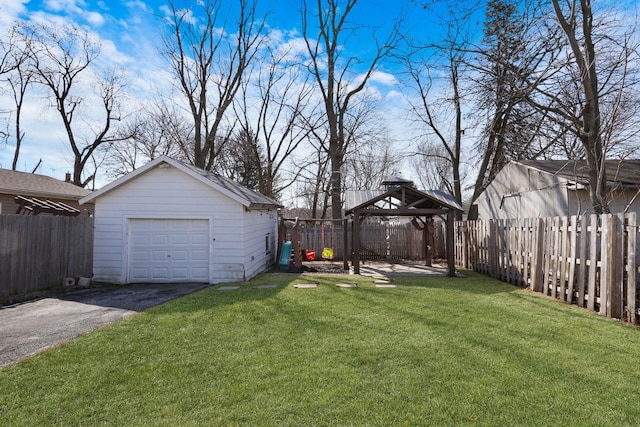 1313 W Cornelia Ave, Waukegan, IL 60085 - view of yard featuring a gazebo, an outbuilding, driveway, and a garage
