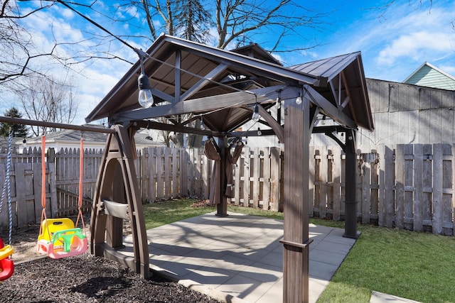 1313 W Cornelia Ave, Waukegan, IL 60085 - fenced backyard with a gazebo and a patio area