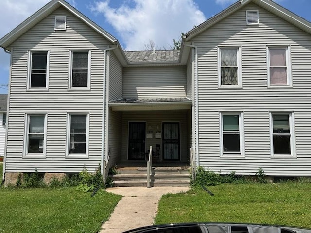 110-112 E Frank St, Freeport, IL 61032 - view of front of property with a front lawn, a porch, and a shingled roof