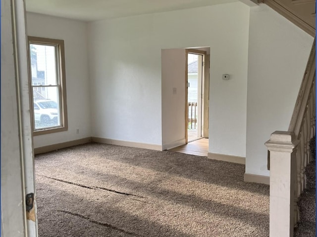110-112 E Frank St, Freeport, IL 61032 - carpeted empty room with baseboards