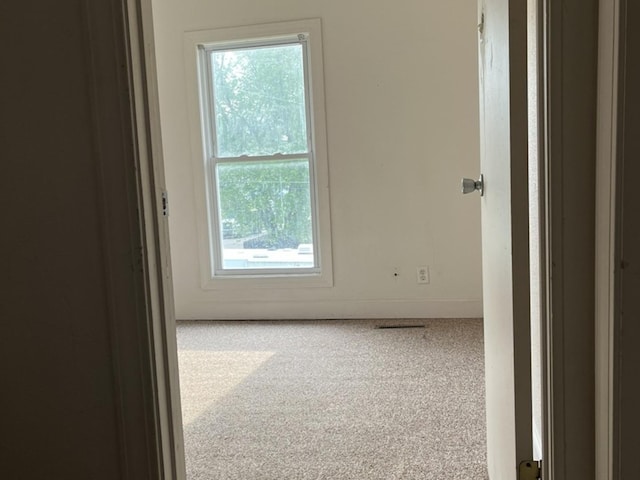 110-112 E Frank St, Freeport, IL 61032 - unfurnished room featuring carpet and baseboards