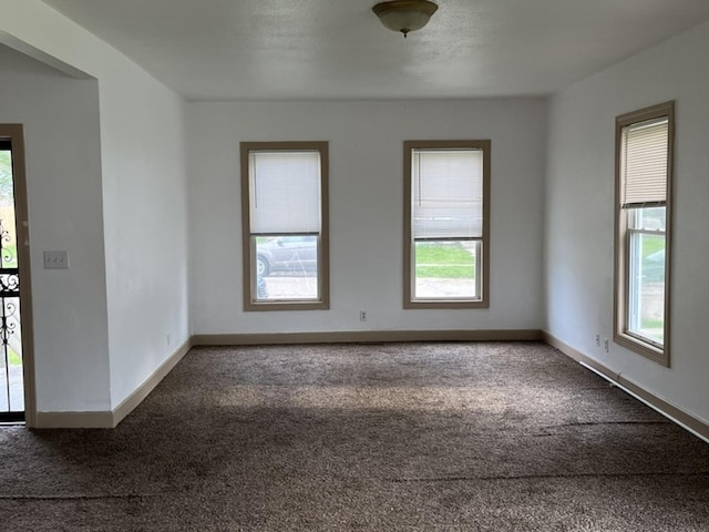 110-112 E Frank St, Freeport, IL 61032 - unfurnished room featuring dark colored carpet and baseboards