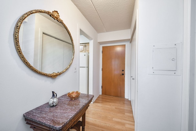 100 W Park Cir Unit 1E, Wheaton, IL 60187 - foyer with light wood finished floors and a textured ceiling