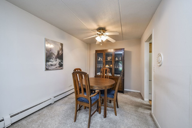 100 W Park Cir Unit 1E, Wheaton, IL 60187 - dining space featuring ceiling fan, a baseboard radiator, light colored carpet, a textured ceiling, and baseboards