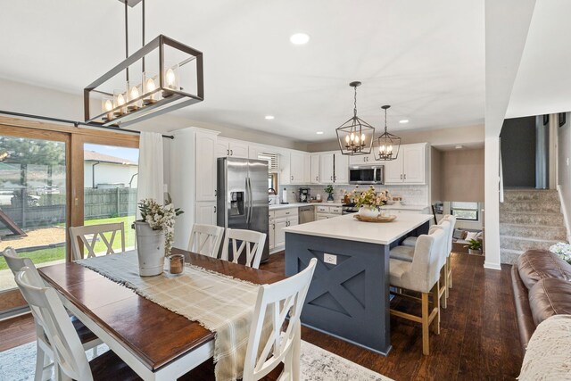 5907 W 124th St, Alsip, IL 60803 - dining area featuring a chandelier, recessed lighting, dark wood finished floors, and stairs