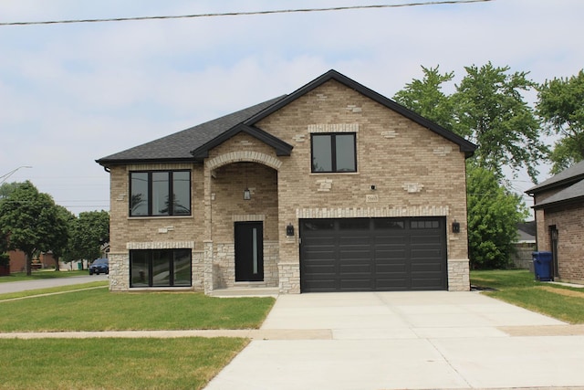 5660 W 83rd Pl, Burbank, IL 60459 - view of front of house with an attached garage, driveway, a front lawn, and brick siding
