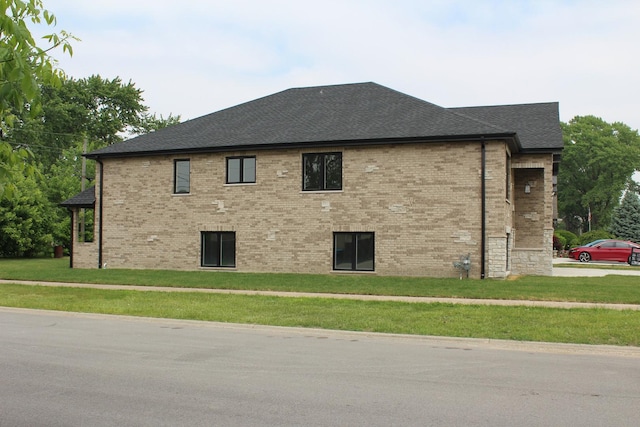 5660 W 83rd Pl, Burbank, IL 60459 - view of side of home with a lawn, a shingled roof, and brick siding
