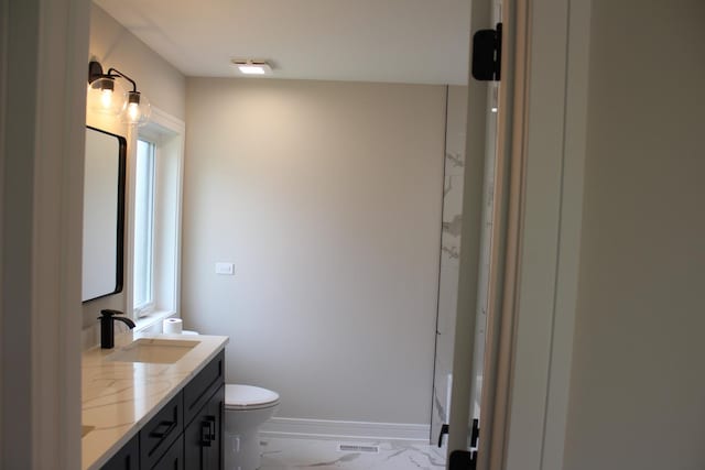 5660 W 83rd Pl, Burbank, IL 60459 - full bath featuring marble finish flooring, double vanity, toilet, and baseboards
