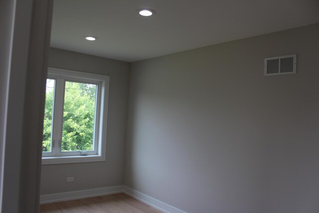 5660 W 83rd Pl, Burbank, IL 60459 - empty room with healthy amount of natural light, baseboards, light wood-style flooring, and recessed lighting