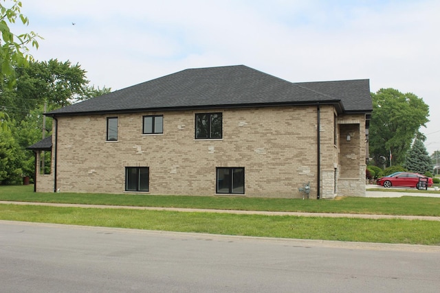 5660 W 83rd Pl, Burbank, IL 60459 - view of property exterior with a yard, a shingled roof, and brick siding