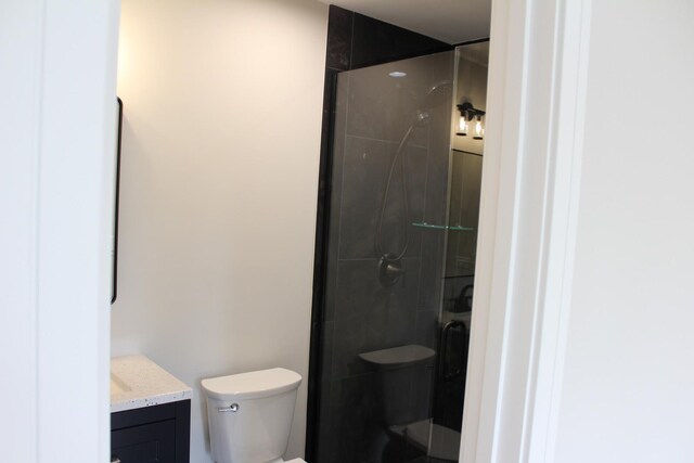 5660 W 83rd Pl, Burbank, IL 60459 - bathroom featuring vanity, toilet, and a tile shower