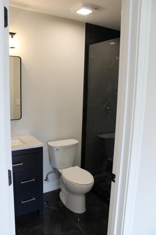 5660 W 83rd Pl, Burbank, IL 60459 - full bath featuring toilet, vanity, a tile shower, and baseboards