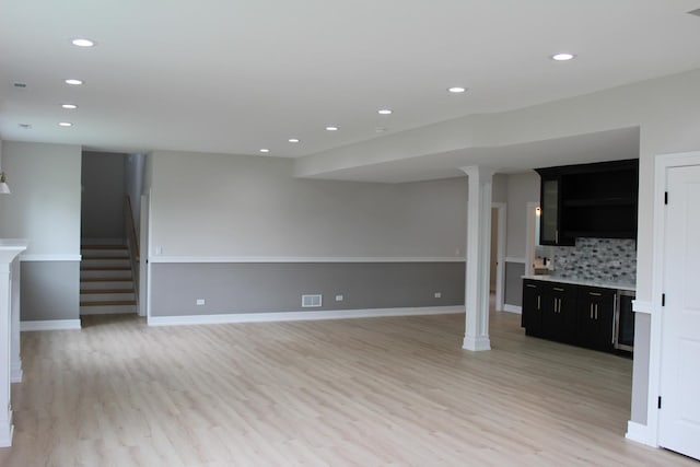 5660 W 83rd Pl, Burbank, IL 60459 - unfurnished living room featuring light wood-type flooring, recessed lighting, stairway, and baseboards